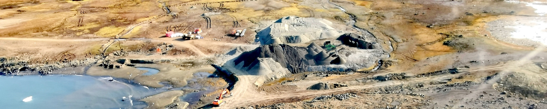 image of aerial view of open cast mine in coastal location