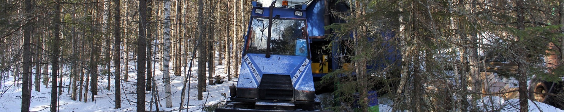 Image of blue tractor drilling machinery in SW Outokumpu